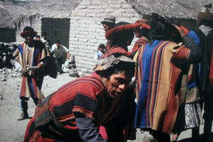 Villagers in Coroma, Bolivia dance in their sacred textiles. The textiles were systematically stolen by Western dealers and imported into the US and Canada. The people of Coroma felt their ancestors had been kidnapped