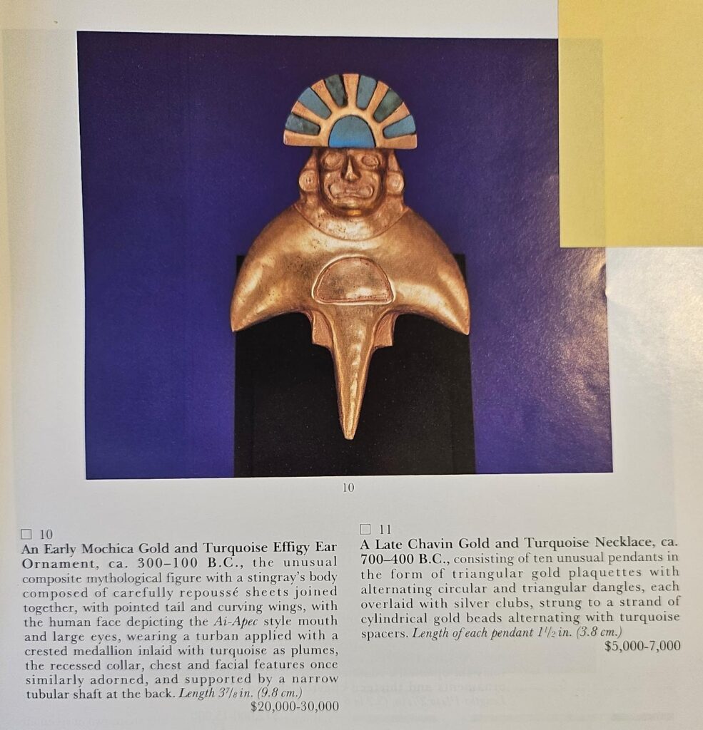 Photograph of an auction catalogue page with an image of a gold stingray shaped Peruvian object with a human head.